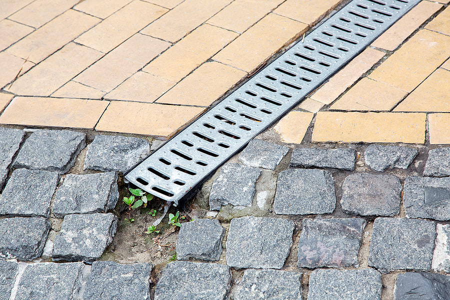 a brick sidewalk drain
